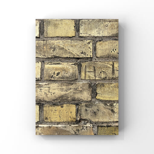 Detailfotografie einer gelben Mauer