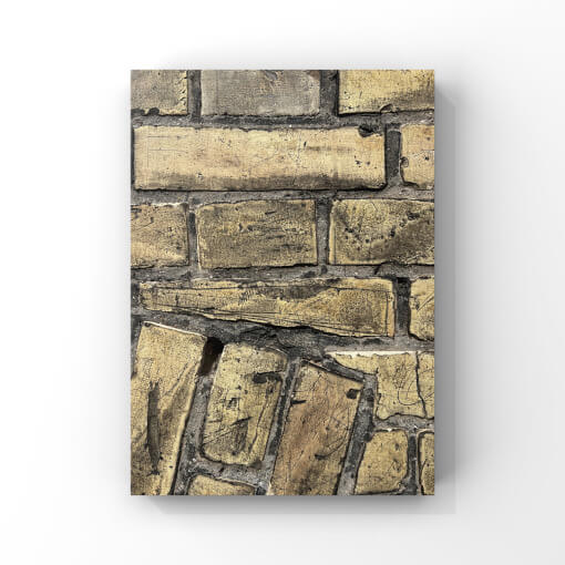Detailfotografie einer gelben Mauer